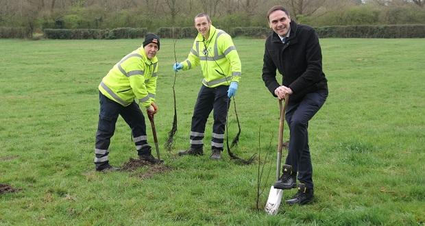 Simon Tagg is pictured planting a lime tree.