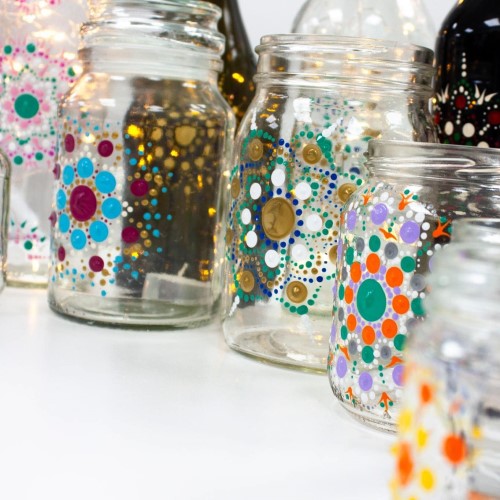 Bottles painted with colourful mandala patterns