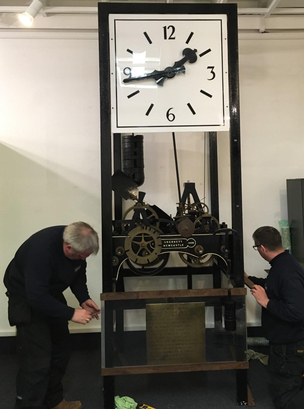 Muncipal hall clock at brampton being serviced