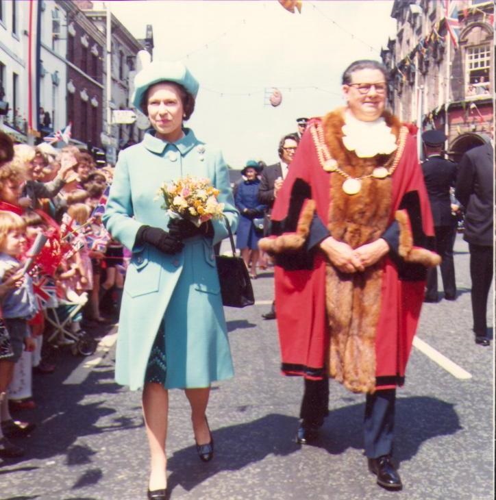 The picture shows Queen Elizabeth ii walking along High Street with the Mayor Cllr Reg Lane in 1973