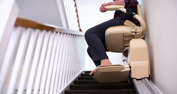 An image of someone using a stair lift.