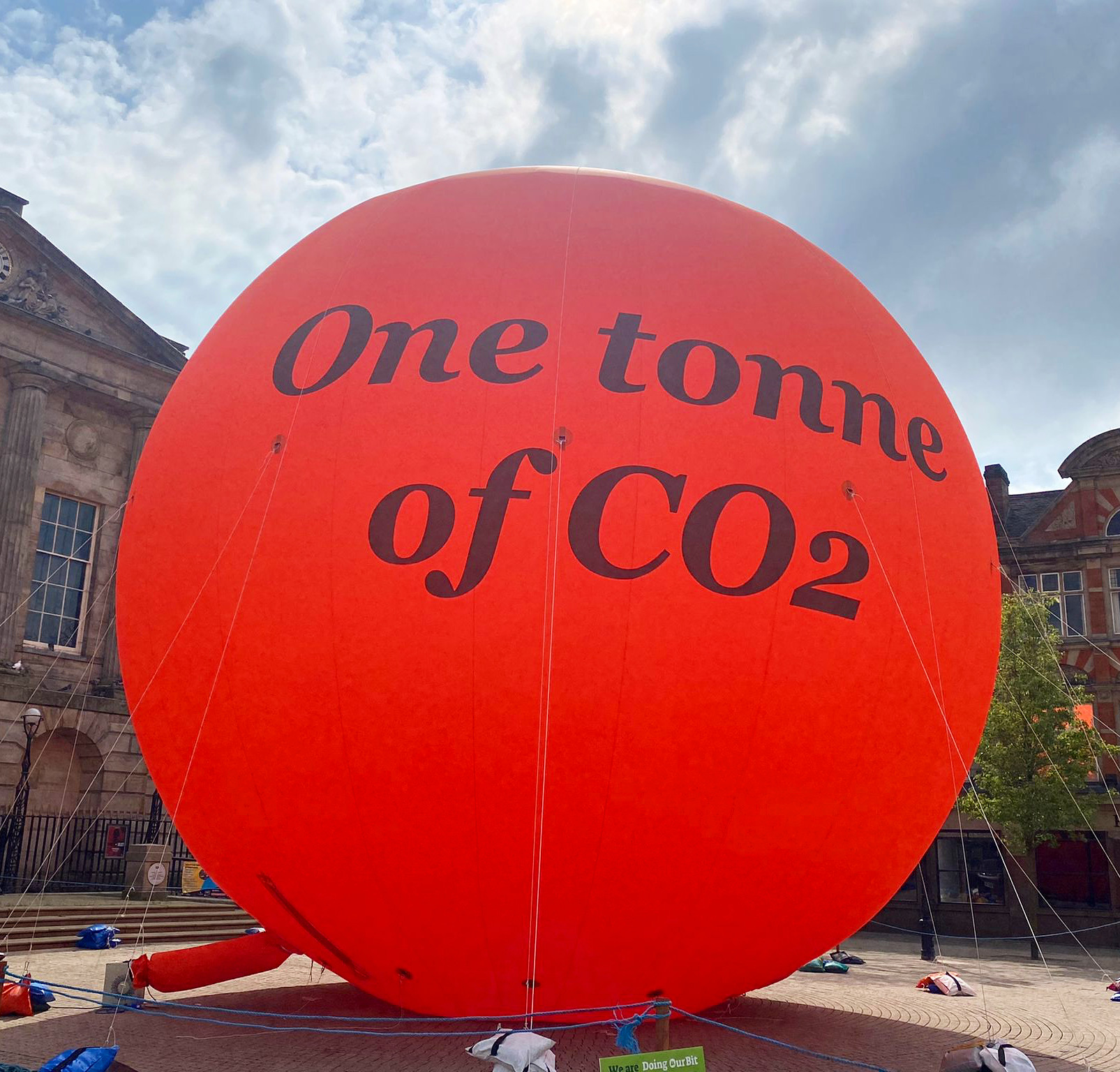 An image of a 10 metre tall orange bubble with the words &#039;One tonne of CO2&#039; written on it.